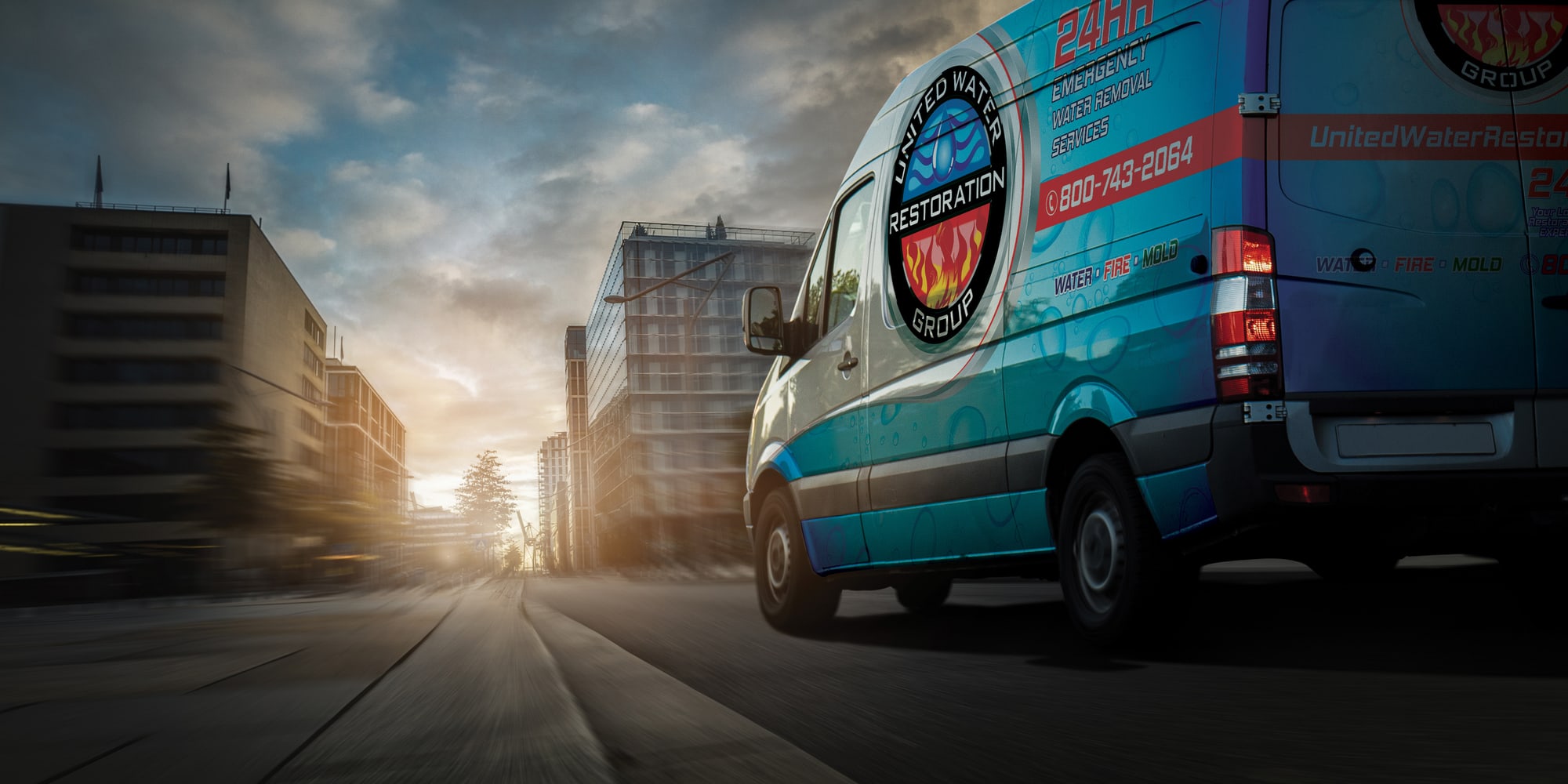 A United Water Restoration Group of Tulsa van heading out on an emergency call at sunset